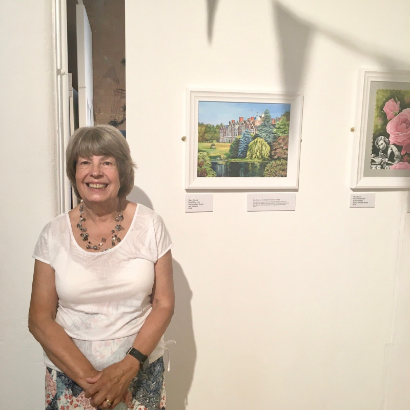 A photo of 'Artist Mary Dennis with her artwork' by Atkins Building